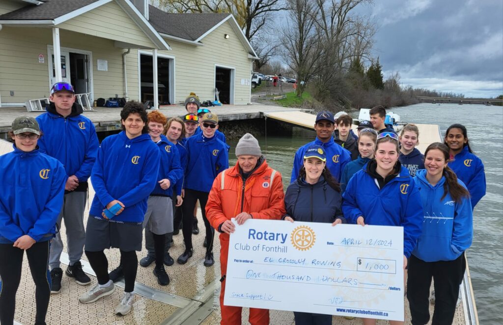 With Rowing Team Members: front, left to right with cheque, Coach Patrick MacNally, Carolyn Mullin, Carole Irwin, Katie Irwin